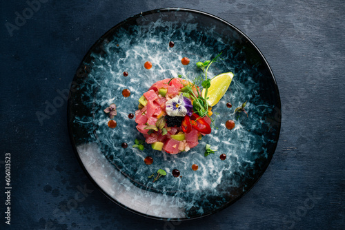 Tuna tartare with avocado, lime, pepper and flying fish caviar. photo