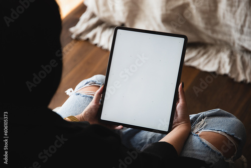 Woman Interacting with iPad Pro Mockup in Modern Interior