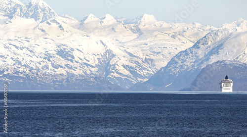 Cruise Ship dwarfed by High Snowcapped Mountains.  Glacier Bay National Park, Alaska.  **Note,  Optical Telephoto Compression, Ship appears out of focus due to Heat Haze**