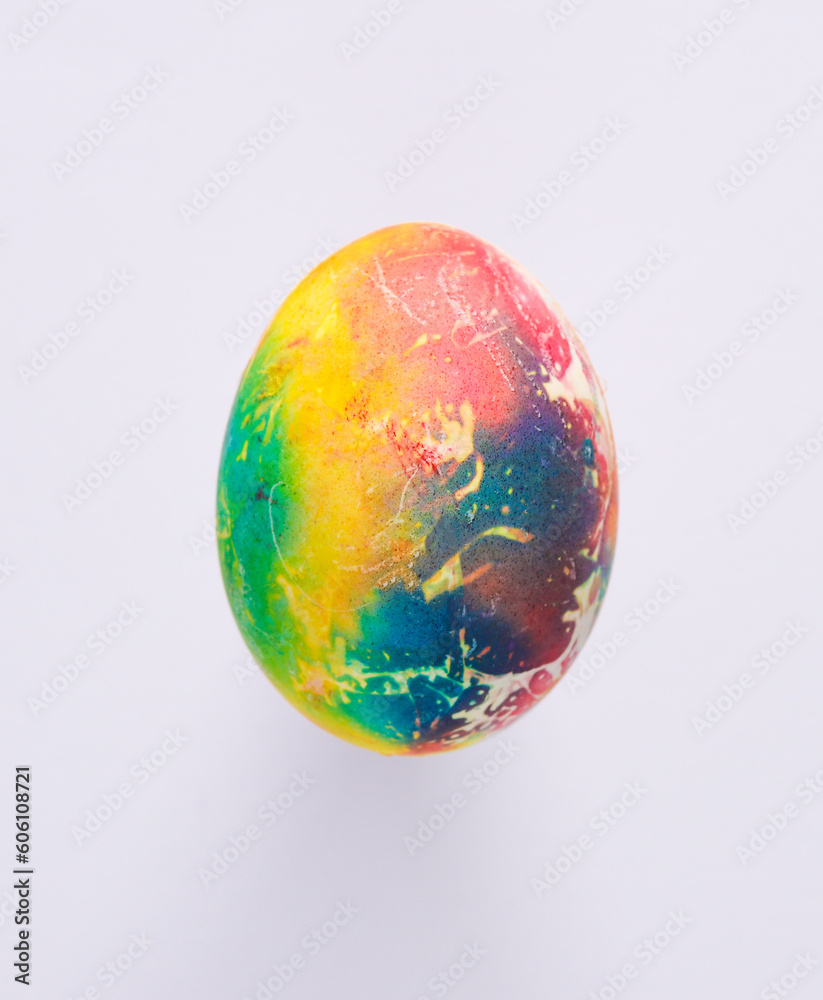 Multicolored Easter egg on a gray background