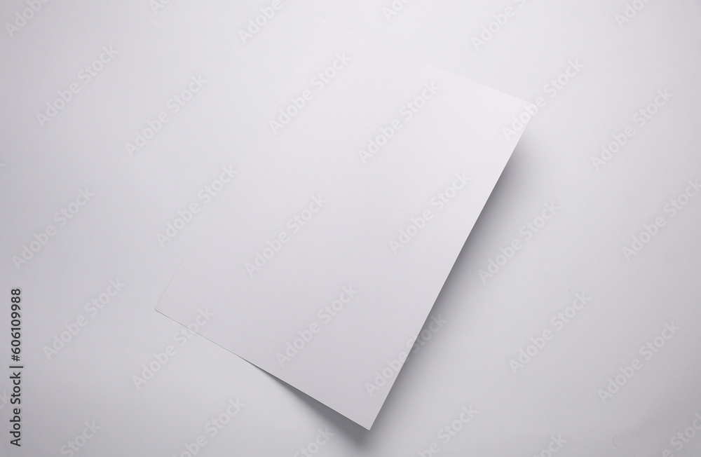Sheet of white paper on white background. Creative layout Sheet of white paper on white background. Creative layout