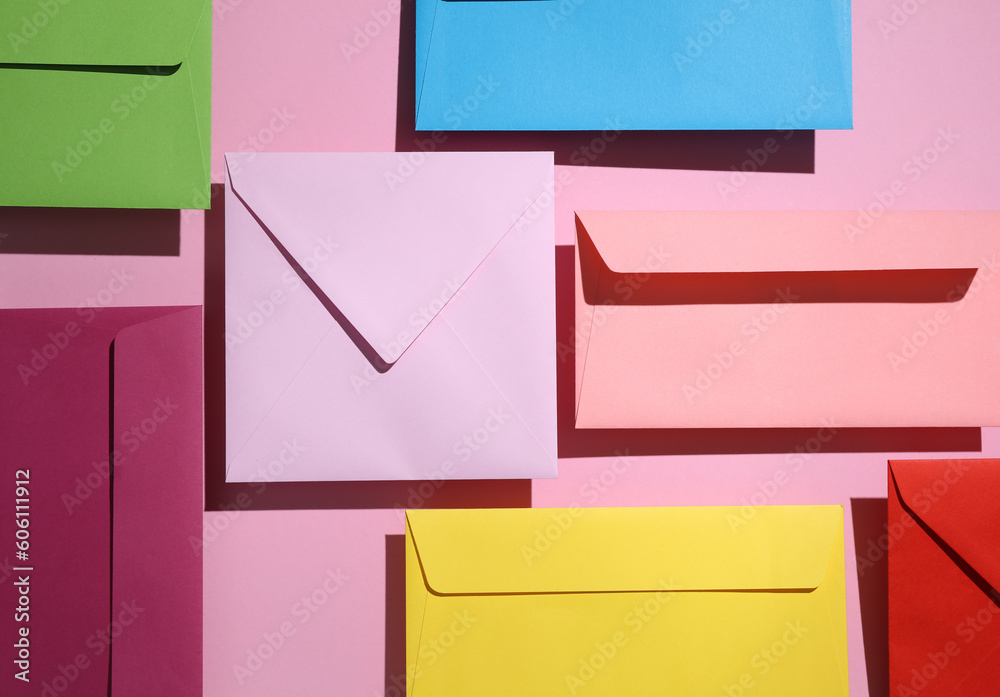Many Colored envelopes on pastel background with shadow. Minimal concept. Creative color layout. Top view Many Colored envelopes on pastel background with shadow. Minimal concept. Creative color layout. Top view