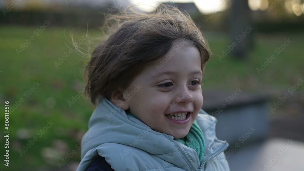 One active little boy runs outside in slow motion in handheld. Happiness concept of child running outdoors and laughing One active little boy runs outside in slow motion in handheld. Happiness concept of child running outdoors and laughing