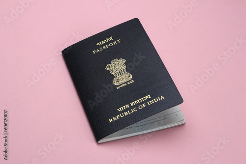 Indian passport on pink background.