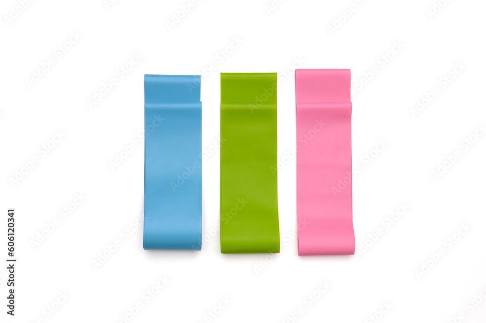 Set of elastic bands for fitness isolated on white. Three fitness bands of different resistance levels, top view. Sports Set of elastic bands for fitness isolated on white. Three fitness bands of different resistance levels, top view. Sports