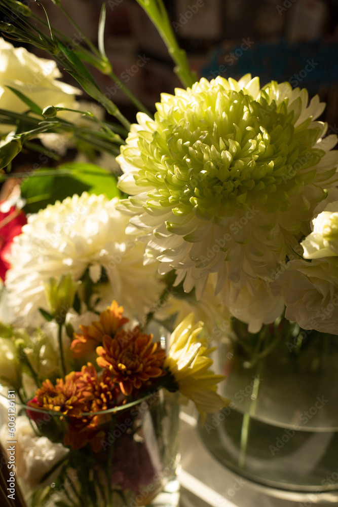 The florist creates a red beautiful bouquet of mixed flowers. Flower shop. Fresh bouquet. Master classes and floristry courses. Flower delivery. The florist creates a red beautiful bouquet of mixed flowers. Flower shop. Fresh bouquet. Master classes and floristry courses. Flower delivery.