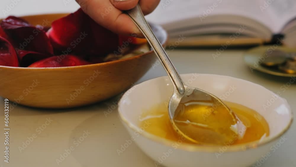A Jewish woman makes a ritual with honey before the wedding for a sweet family life. slow motion A Jewish woman makes a ritual with honey before the wedding for a sweet family life. slow motion