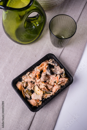 Salmon and tuna fillet with sweet pepper, onion, tomatoes and zucchini on table.