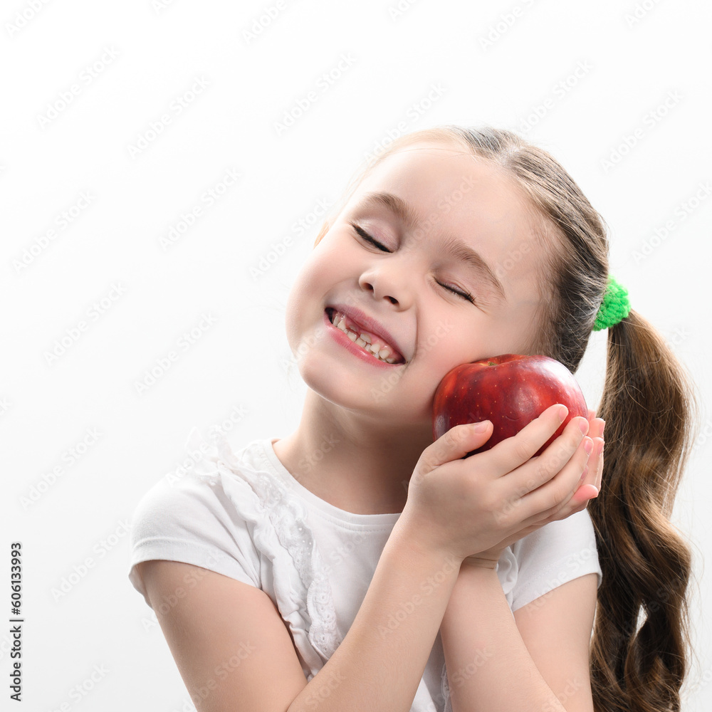 Red apple and little girl, portrait of a child on a white background Red apple and little girl, portrait of a child on a white background