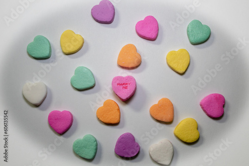 Valentine's conversation hearts with Marry Me text. © Romar66