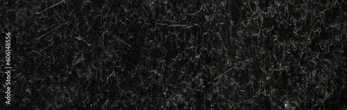 Black granite surface. Grunge stone texture. Basalt surface background