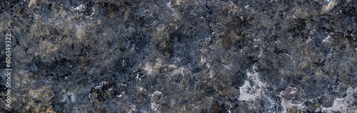 Close up of granite surface. Grunge stone texture. Basalt surface background