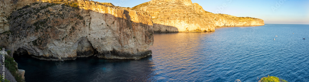 Blue cave in cliffs on southern coast of Malta with turquoise water Blue cave in cliffs on southern coast of Malta with turquoise water