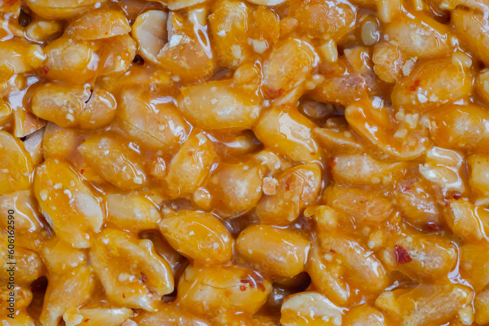 Top view: Gozinaki - caramelized nuts fried in honey - orange granola peanut bar - close up, macro. Traditional Georgian cuisine, gastronomy, oriental sweet and food concept Top view: Gozinaki - caramelized nuts fried in honey - orange granola peanut bar - close up, macro. Traditional Georgian cuisine, gastronomy, oriental sweet and food concept