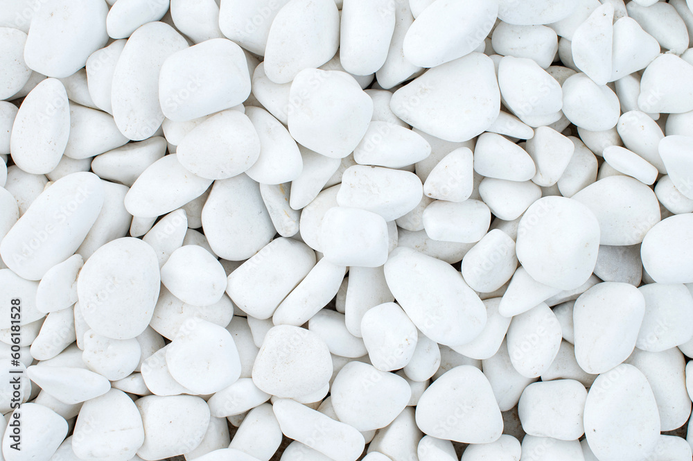 Pure texture of white pebbles. Small stones on the ground. Top view of the natural colorful gravel Pure texture of white pebbles. Small stones on the ground. Top view of the natural colorful gravel