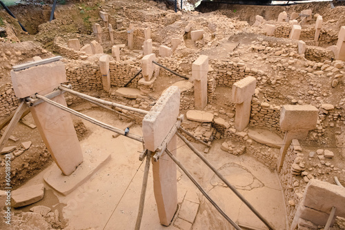 Gobekli Tepe is an ancient site in Turkey that dates back approximately 11,000 years. It is considered one of the oldest examples of monumental architecture. photo