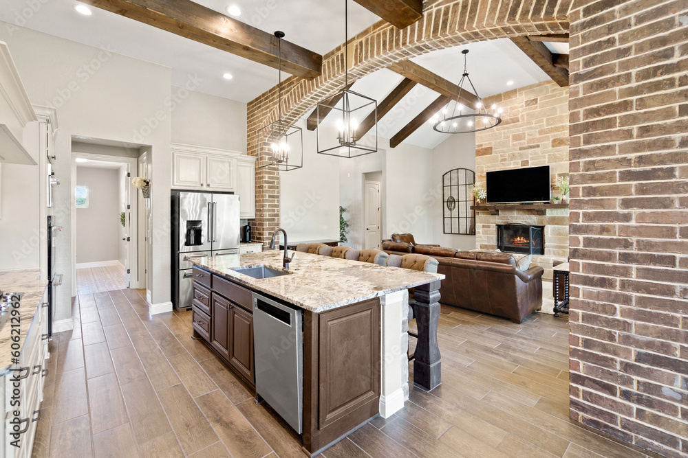white kitchen with brick and wood beams 