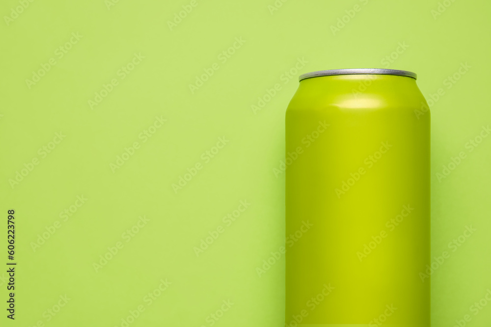 Can of soda on green background, closeup Can of soda on green background, closeup