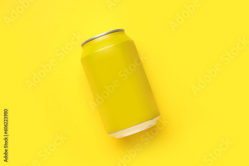 Can of soda on yellow background