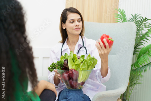 Female woman having a consulting with a professional doctor or nutritionist about eating and nutrition.