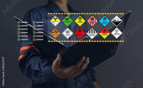 Customs warehouse staff holding clipboard documents check list inspect dangerous goods store in the warehouse waiting to be transport or distribute to the production process. dangerous goods concept.