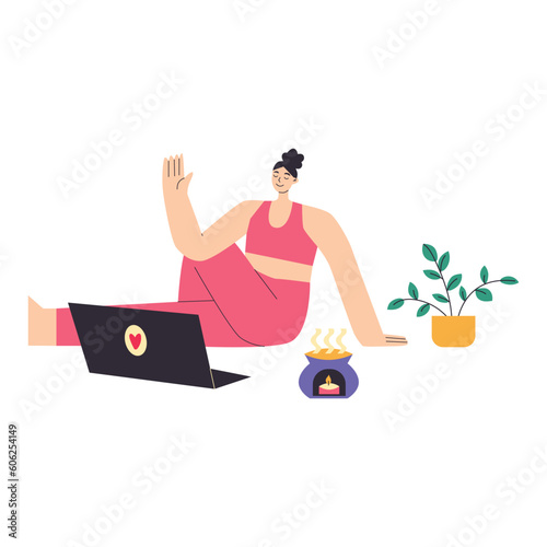 Yong woman watching online yoga classes on laptop, practicing yoga at home.
