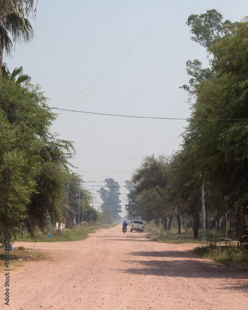 A street in the Chaco on a smoky morning from burning fields before planting.