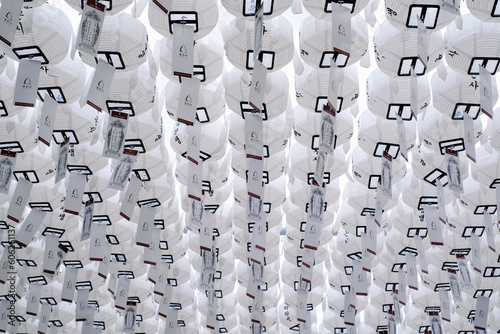 White lanterns hang installed in a shrine in Seoul, South Korea.