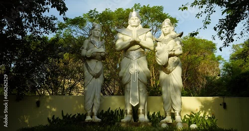 Dolly forward shot of the three statues in cultural park ungasan in bali indonesia during the golden hour photo