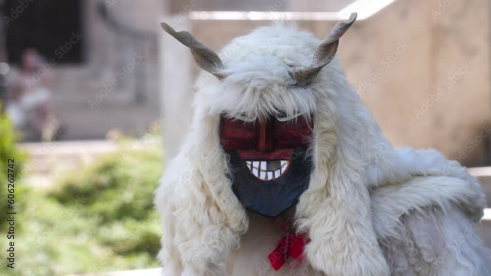 Person Wearing Traditional Hungarian Buso Costume During Busojaras Carnival In Hungary. closeup Person Wearing Traditional Hungarian Buso Costume During Busojaras Carnival In Hungary. closeup
