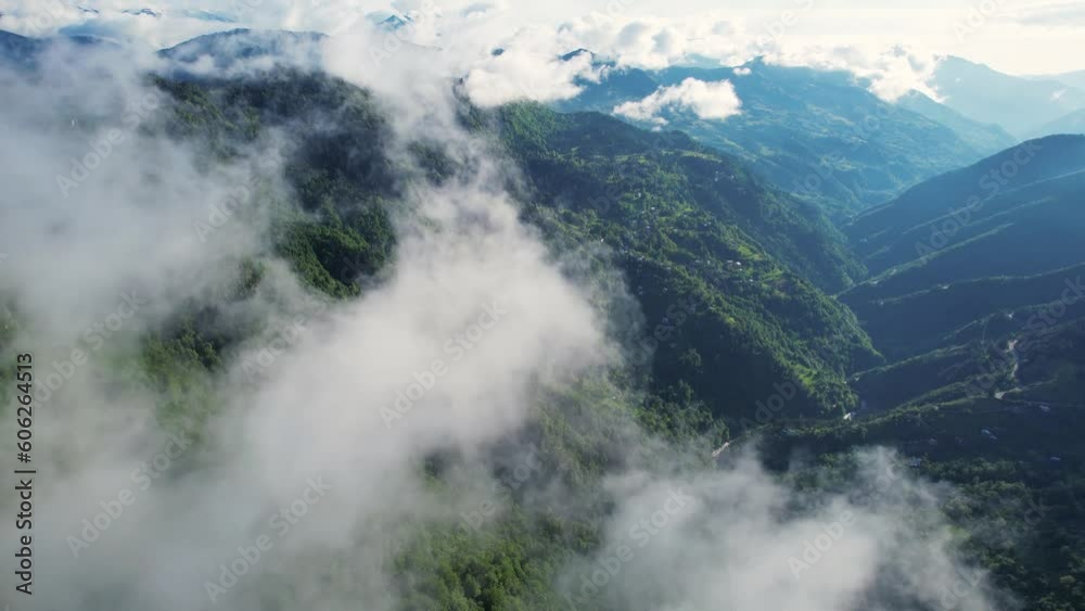 Flying through the clouds. Sunny green mountains background. Flying through the clouds. Sunny green mountains background.