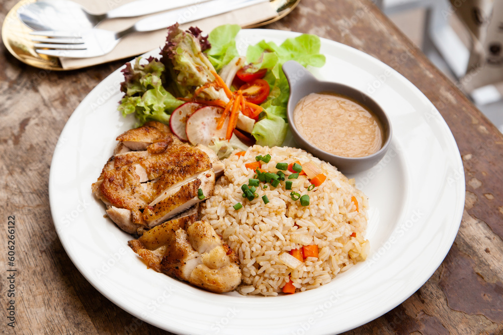 Garlic fried rice with grilled chicken and salad