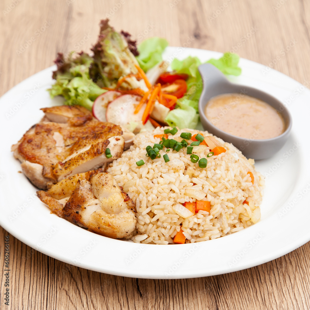 Garlic fried rice with grilled chicken and salad Garlic fried rice with grilled chicken and salad