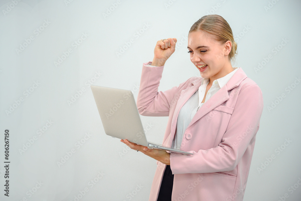 Creative young woman working on laptop in her studio Creative young woman working on laptop in her studio