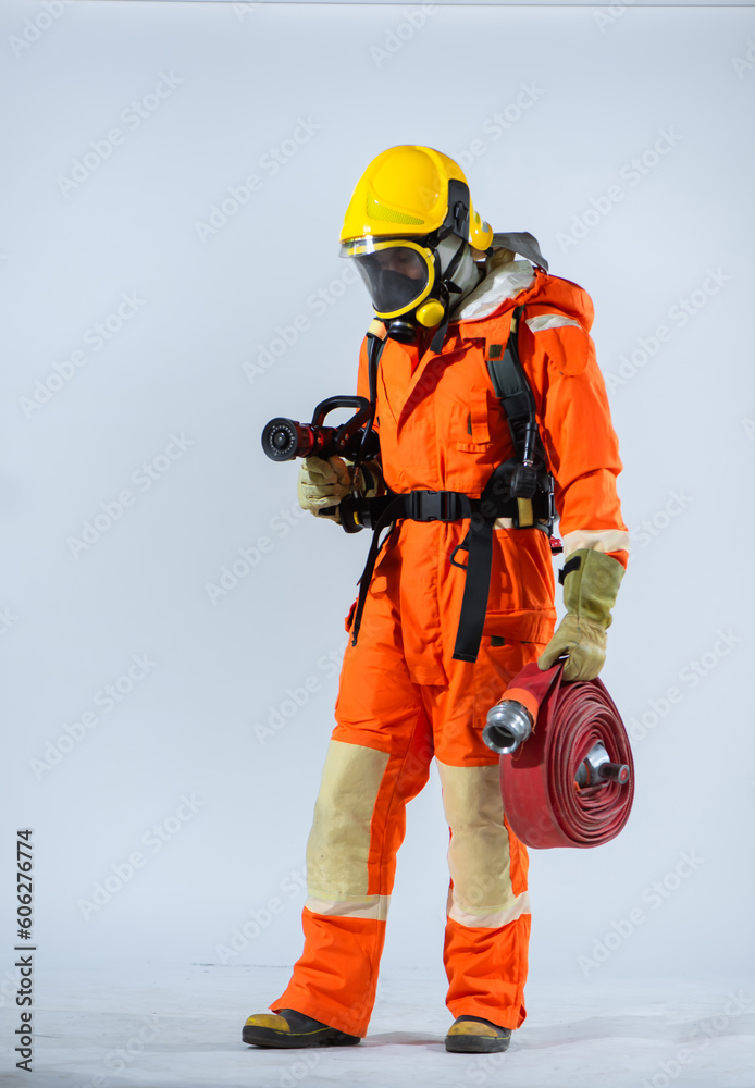 With a determined focus, the firefighter maintains a strong and steady grip on the fire hose demonstrating their expertise in managing the powerful tool that is vital in firefighting operations. With a determined focus, the firefighter maintains a strong and steady grip on the fire hose demonstrating their expertise in managing the powerful tool that is vital in firefighting operations.