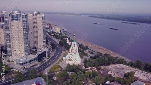 Sofiyskiy Sobor church by Volga river coastline beach of Samara, Russia, aerial parallax photo