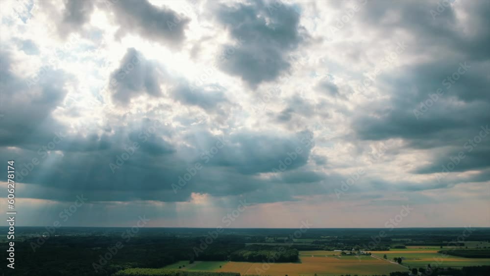 Aerial timelapse of amazing sunbeams shining through nimbostratus clouds. Aerial timelapse of amazing sunbeams shining through nimbostratus clouds.