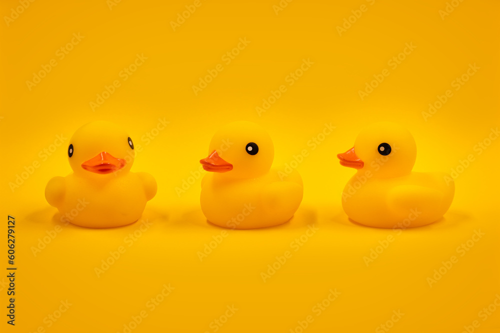 Yellow rubber ducks and one in a row Yellow rubber ducks and one in a row