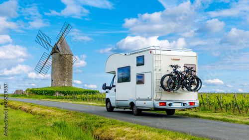 Family travel- Road trip in motorhome-vineyard and windmill- France, Bordeaux region, Nouvelle aquitaine