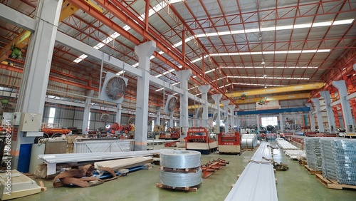 Large industrial buildings or factory with steel structures. Large industrial hall. Warehouse for storage and distribution products of metal sheet roof plant
