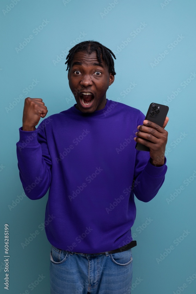 joyful american young man with dreadlocks won the competition joyful american young man with dreadlocks won the competition