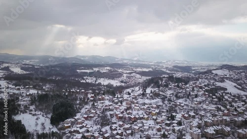 Aerial cinematic drone winter Olympic downtown snowy streets roads Sarajevo City center Avaz twist Bosnia and Herzegovina cars and highway frozen war ruins landscape mid day slow circle right movement photo