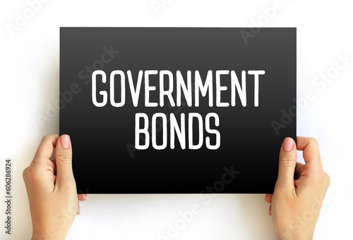 Government Bonds - debt obligation issued by a national government to support government spending, text concept on card photo