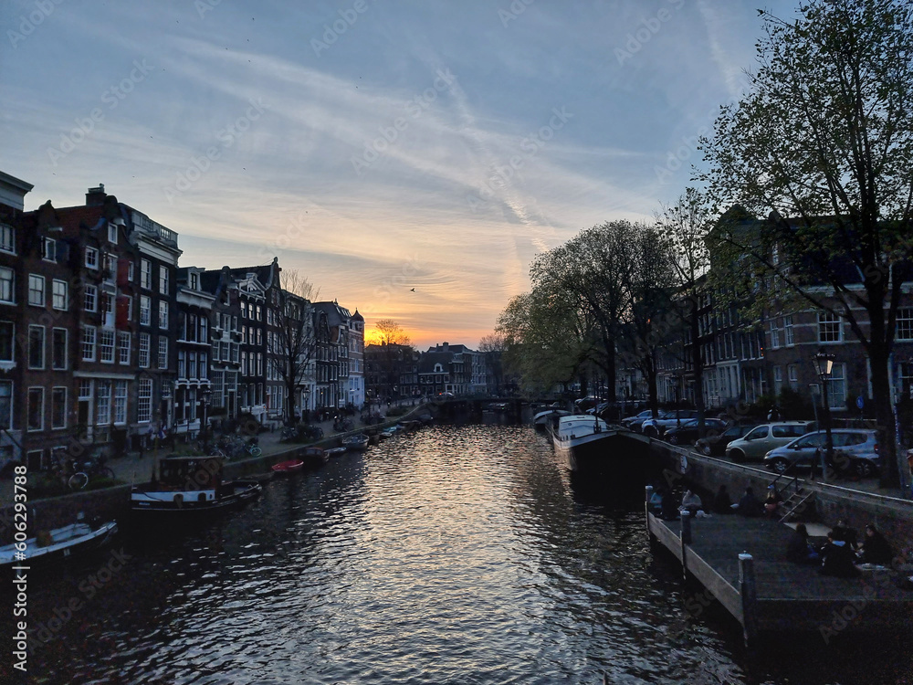 Amsterdam Reflections: Serene Canals in Sunset's Golden Glow