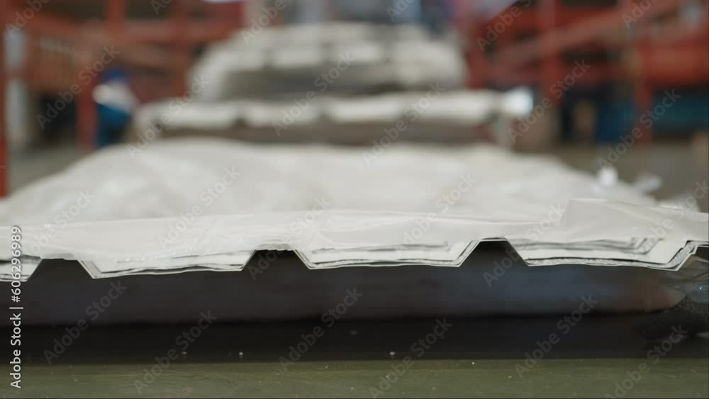 Close up stack of roofing sheets in metal sheet factory. Metal sheet ...
