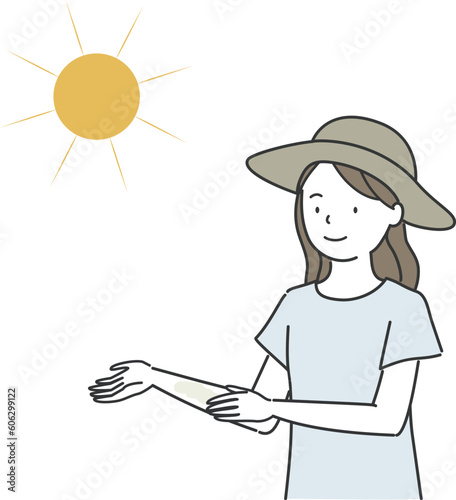 太陽の下で日焼け止めクリームを塗る女性