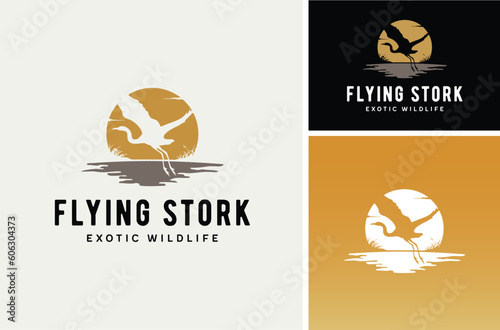 Sunset Sun with Flying Stork Heron Bird over the River Creek lake grass silhouette nature wildlife logo design 