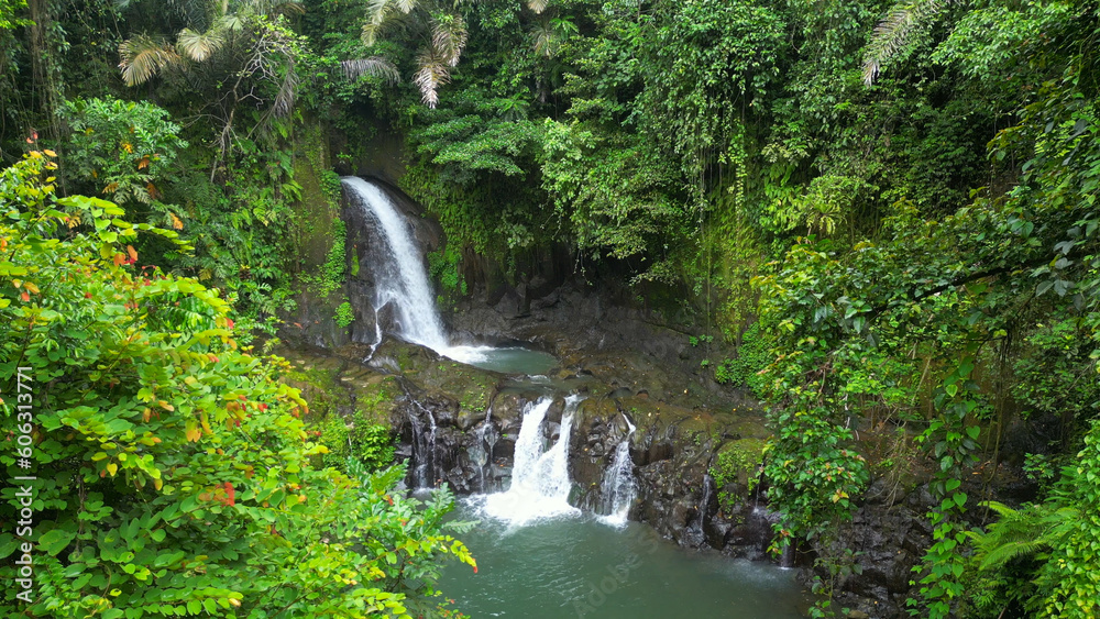 Pengibul Waterfall. The uniqueness of Pengibul Waterfall is that this waterfall is multilevel. The waterfall at the top level has a height of about 15 meters. Bali.	