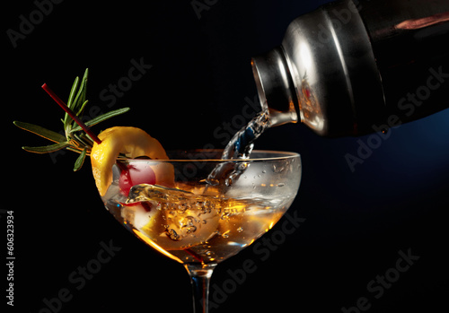 Cocktail with cherry, rosemary, and lemon.