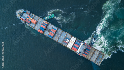 Aerial view container ship and tugboat drag shipping to seaport, Container ship load container for global business logistics import export, Freight shipping and transportation.